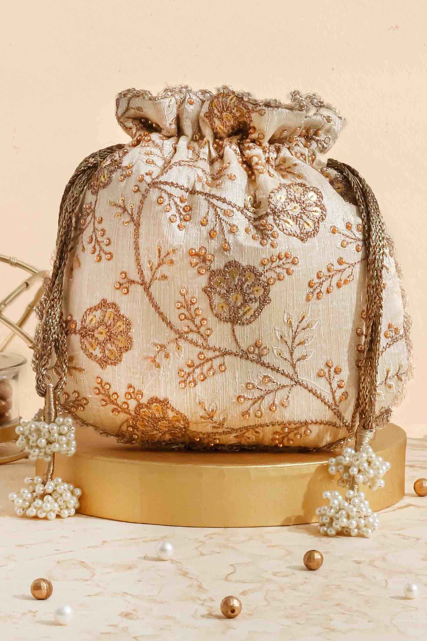 AMYRA Cream embroidered scallop potli bag