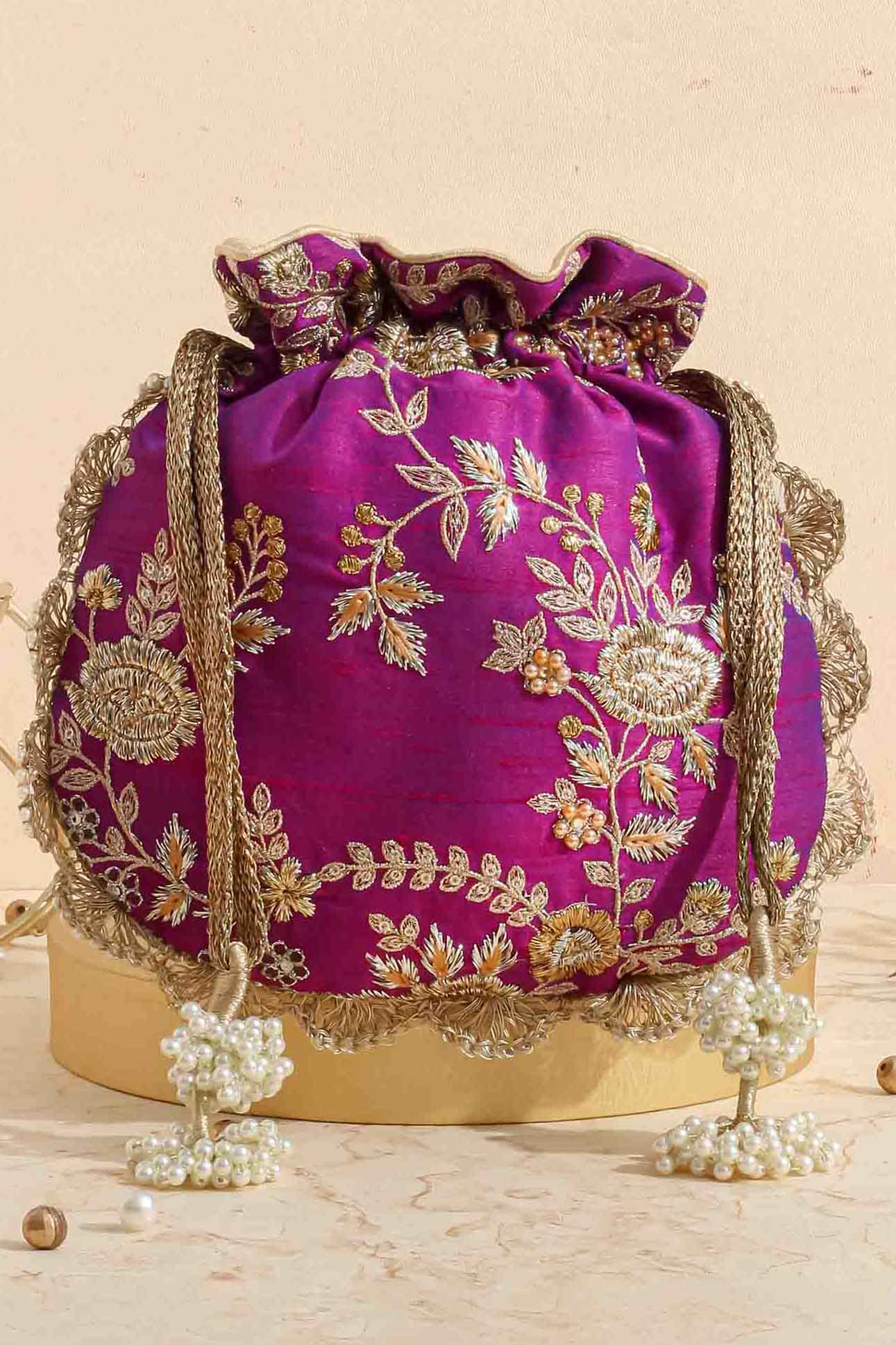 AMYRA Purple embroidered scallop potli bag