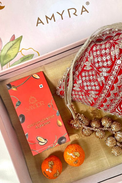 Gift hamper - Mirai embroidered red potli - Gourmet & Candle box