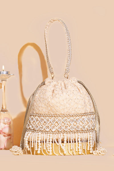 AMYRA Amara embroidered bucket bag - Nude