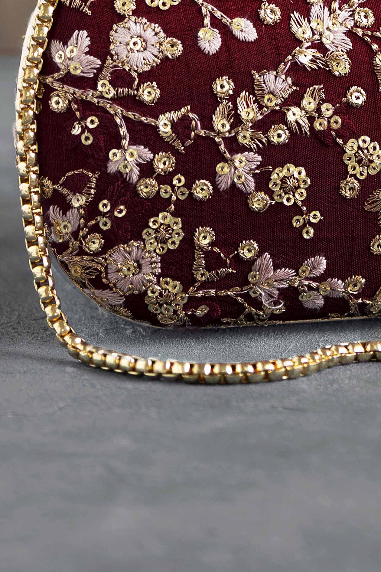 Elan maroon silk capsule clutch