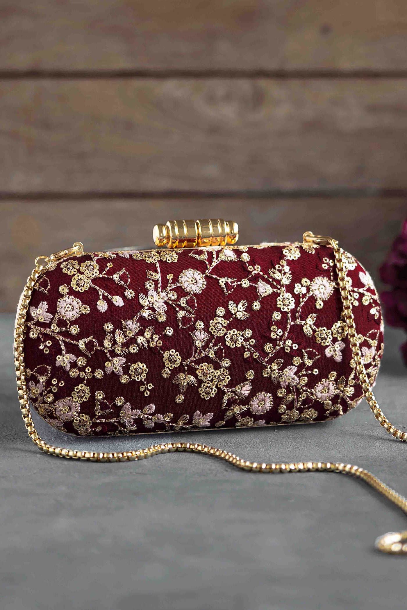 AMYRA Elan maroon silk capsule clutch