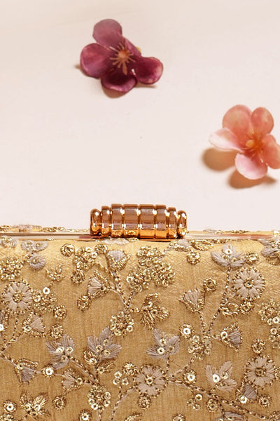 AMYRA Elan gold silk capsule clutch