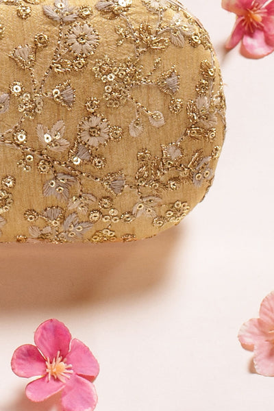 AMYRA Elan gold silk capsule clutch