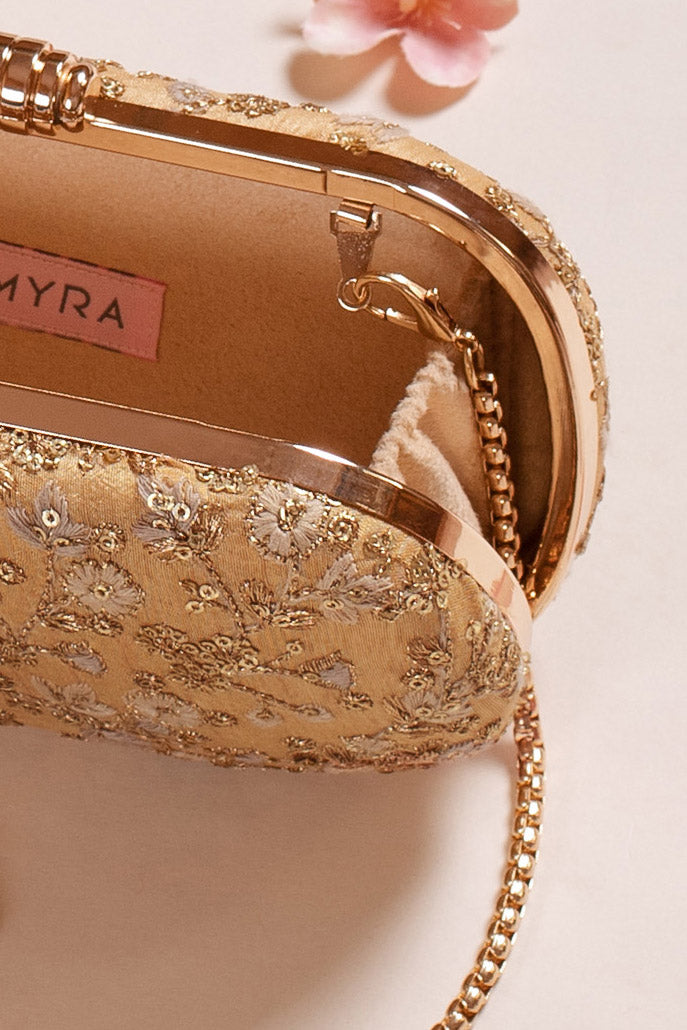 AMYRA Elan gold silk capsule clutch