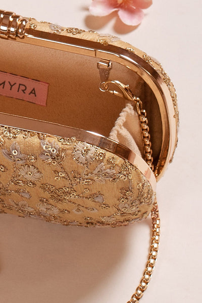 AMYRA Elan gold silk capsule clutch