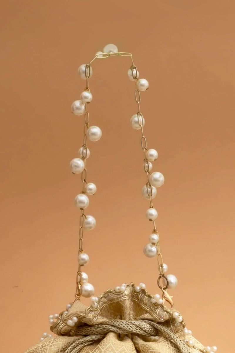 Geet Brocade Embellished Potli - Cream