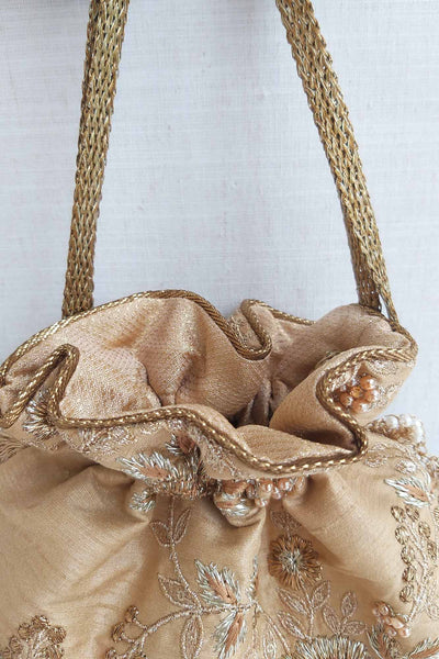 AMYRA Gold scallop potli bag