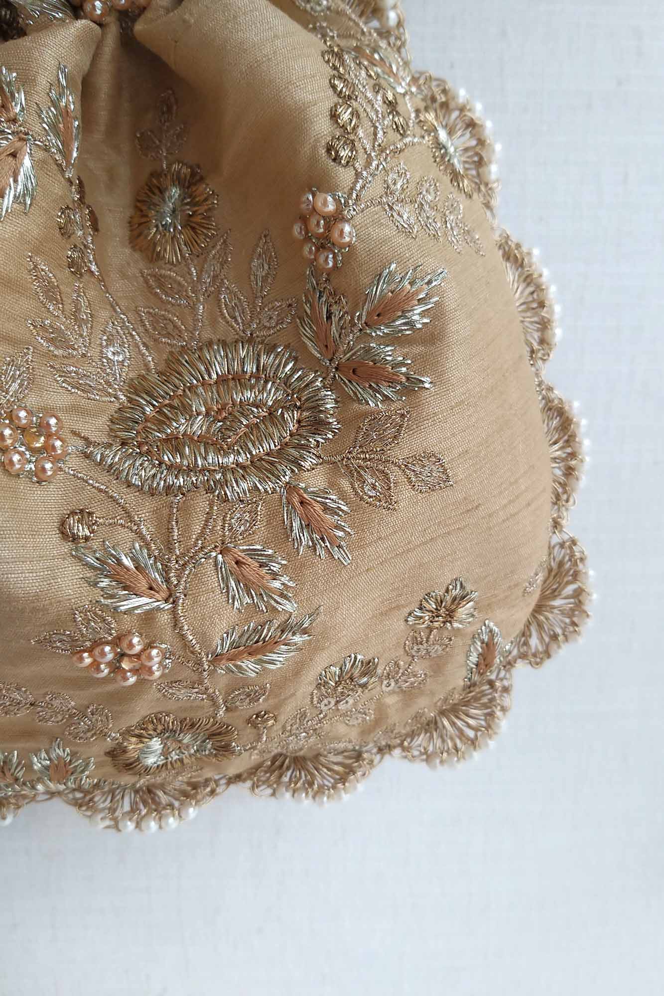 AMYRA Gold scallop potli bag