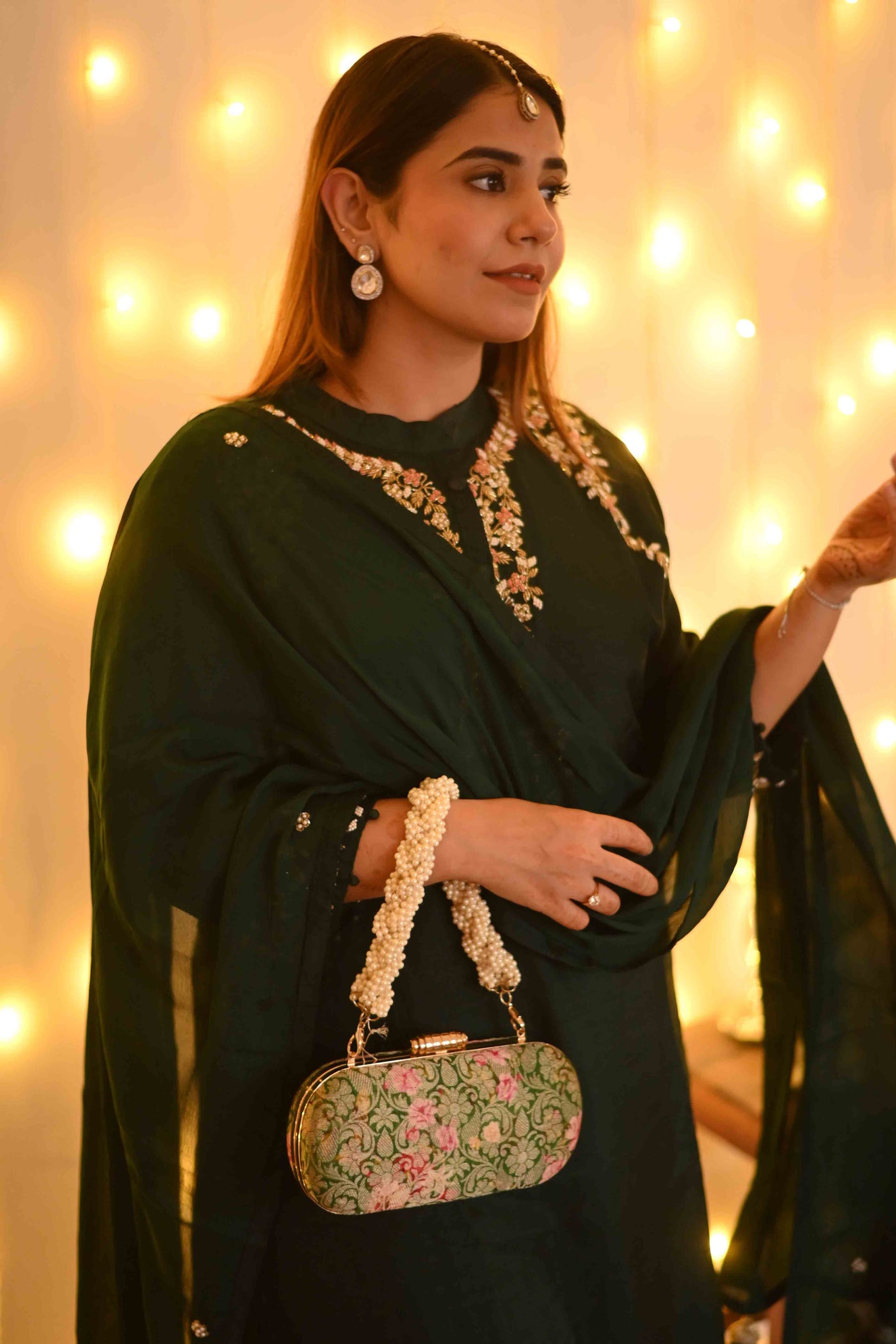 AMYRA Elora green capsule clutch
