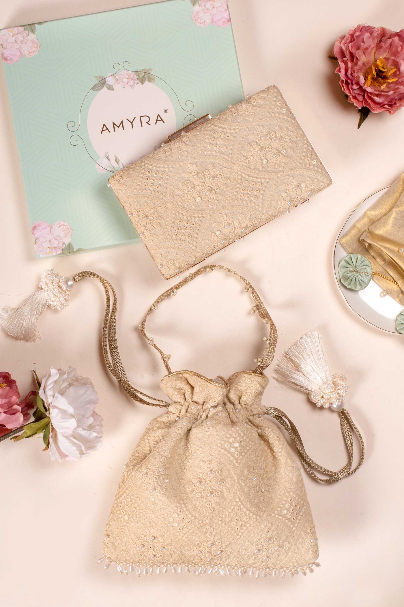 AMYRA oyster beige pearl clutch