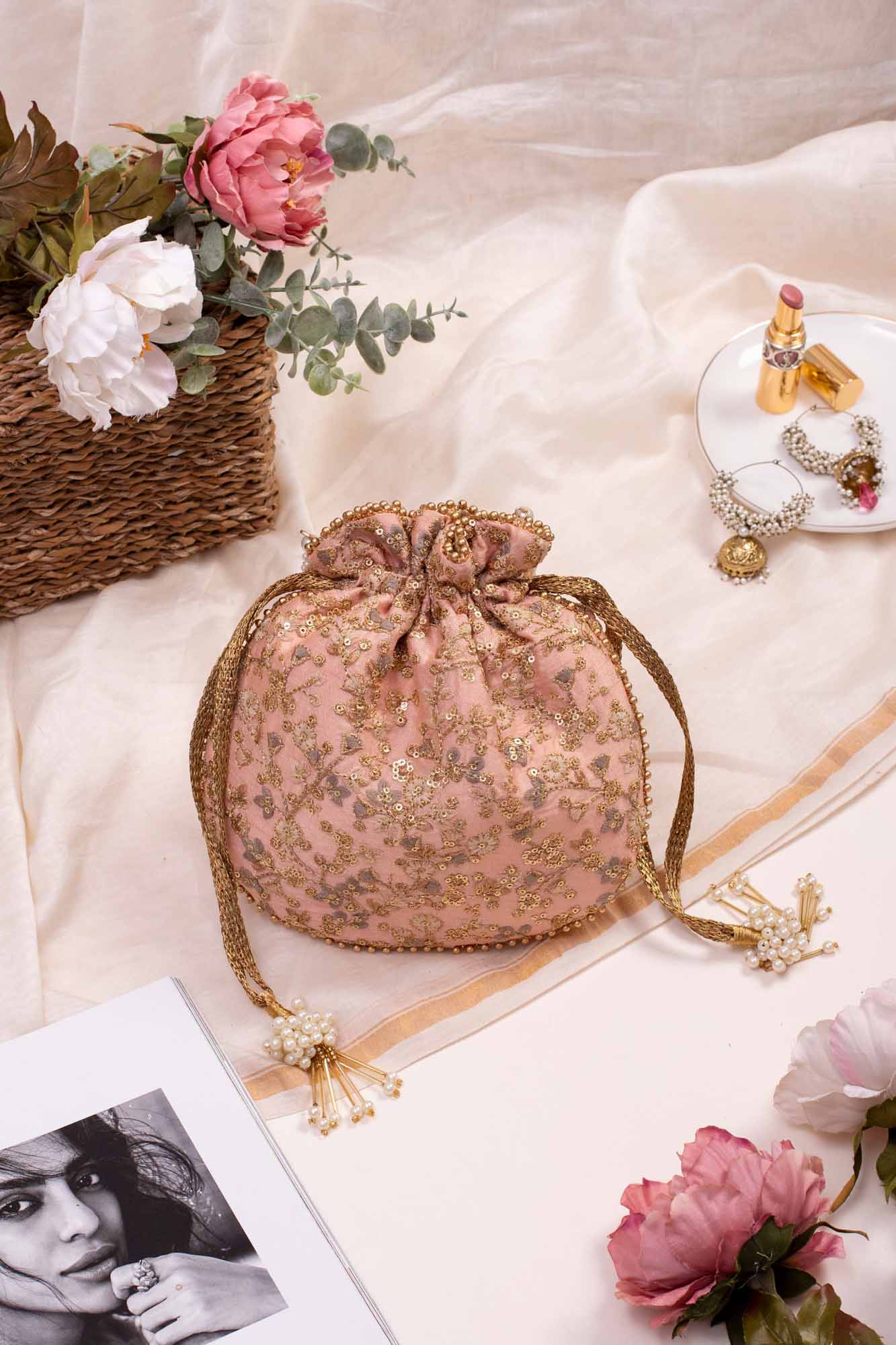 AMYRA Peach floral embroidered potli bag