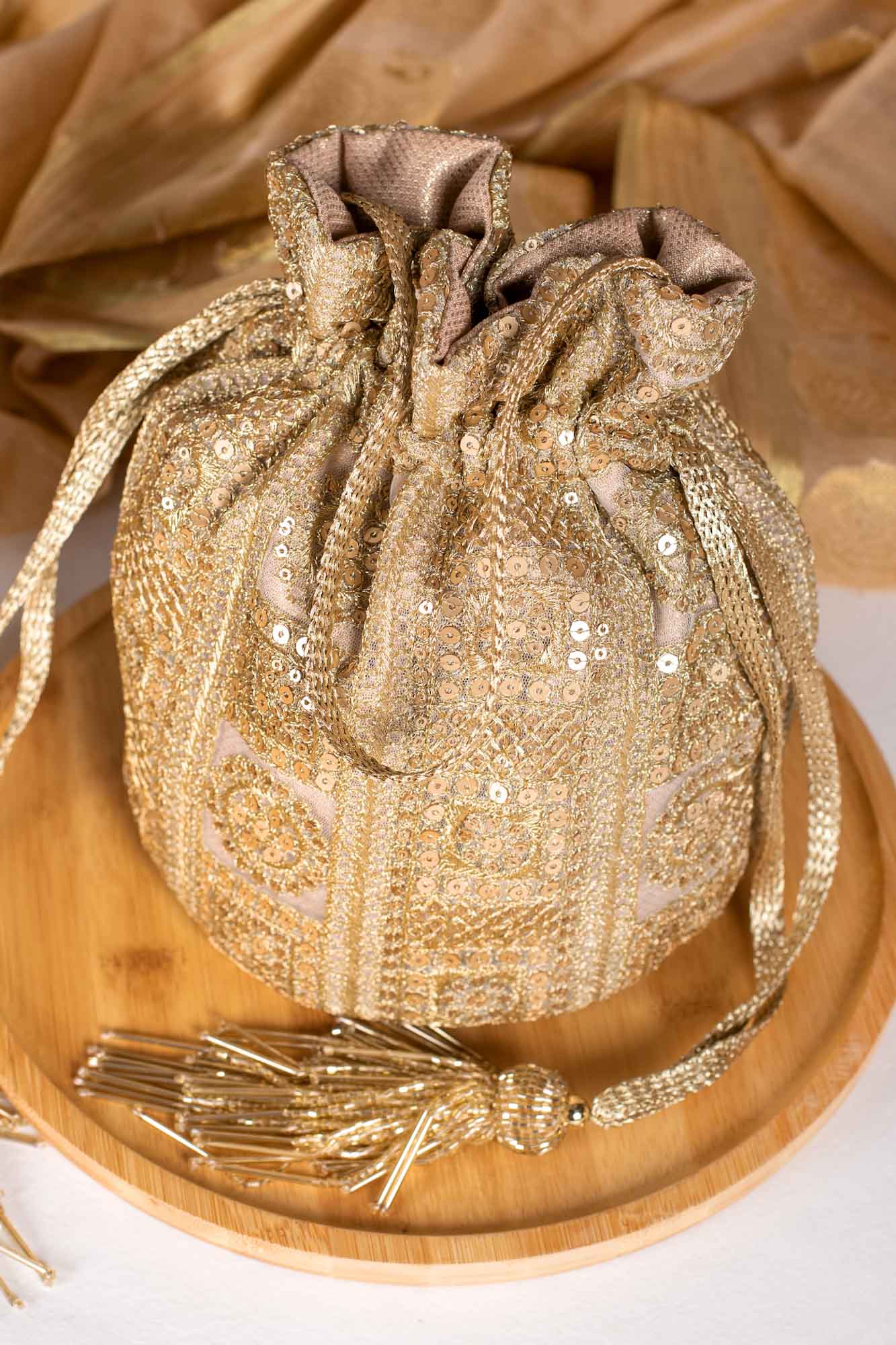 Buy Amyra Ethnic Motif Woven Design Banarasi Silk Potli bag Online at Best  Price | Distacart